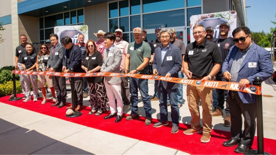 Kioti Tractor employees celebrate at a ribbon cutting ceremony in Washington