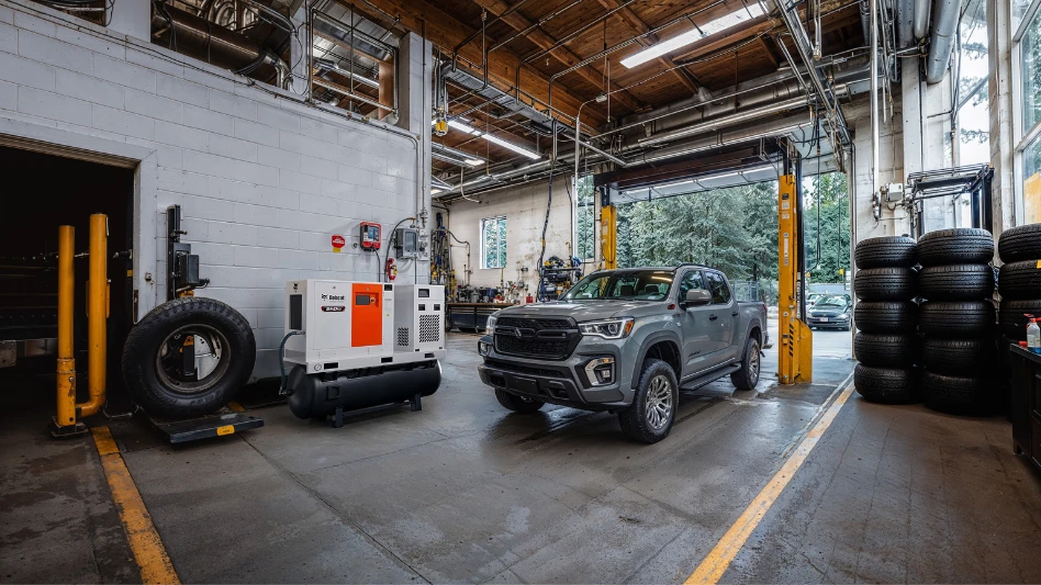 A truck sits beside a Bobcat tank-mounted air compressor