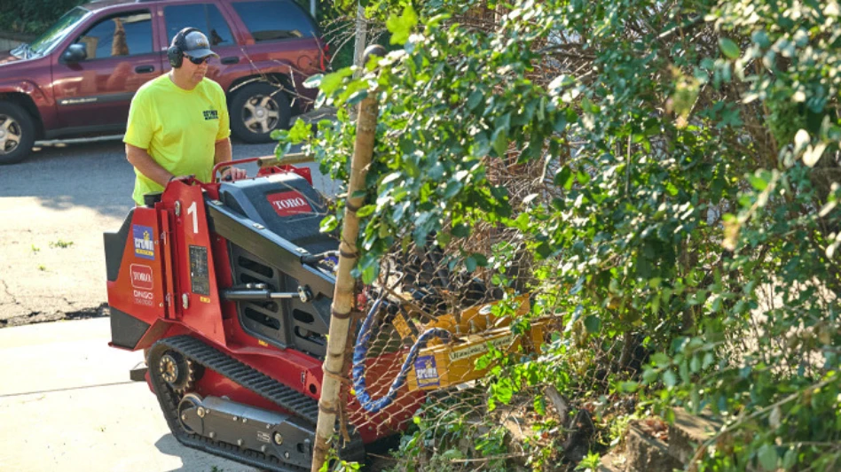 A volunteer rides a Toro machine during volunteer work at Bolder Options